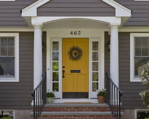 home with focal door of bright yellow