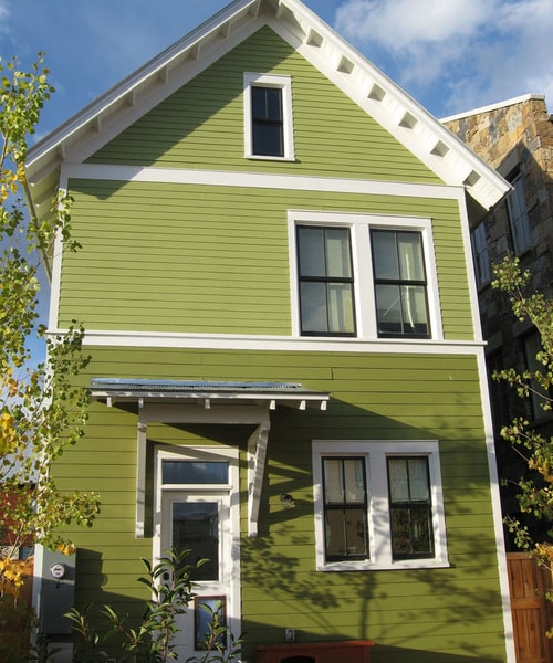 bright green hues vary from top to bottom of home exterior