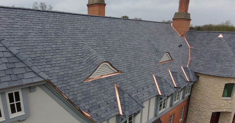 An ornamental composite slate roof? You might not expect it, but the aesthetic beauty it lends the home speaks for itself. 
