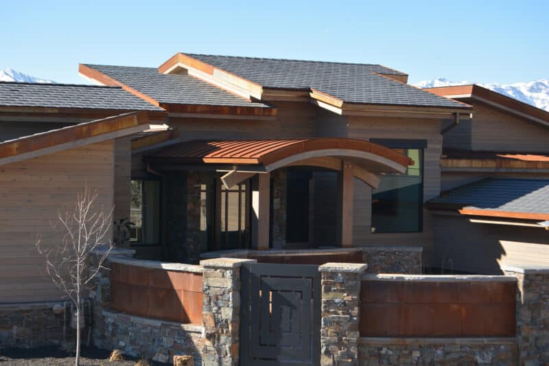 Lightweight composite roofing on custom homes can reduce costs without diminishing curb appeal. 